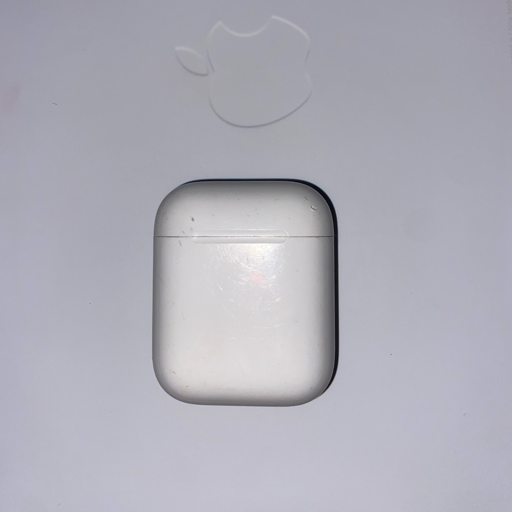 AirPods case and one left airpod